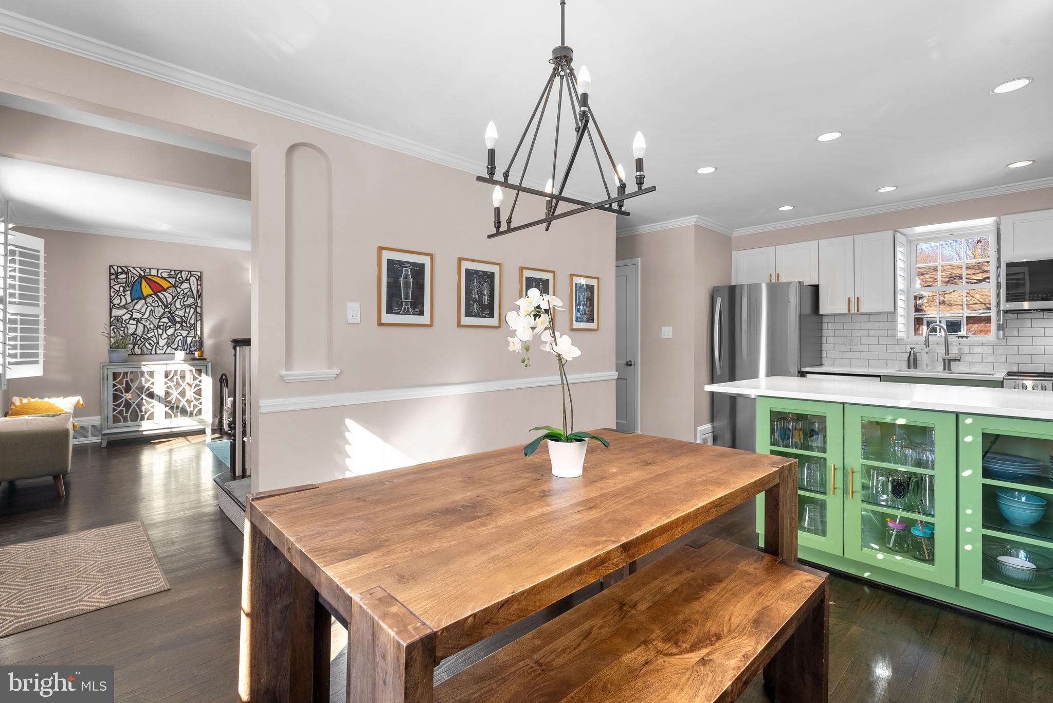 707 Forest Glen Road Silver Spring, MD 20901 - Photo 5 of 48 a dining table with a chandelier