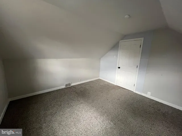 a view of a livingroom with furniture and a window