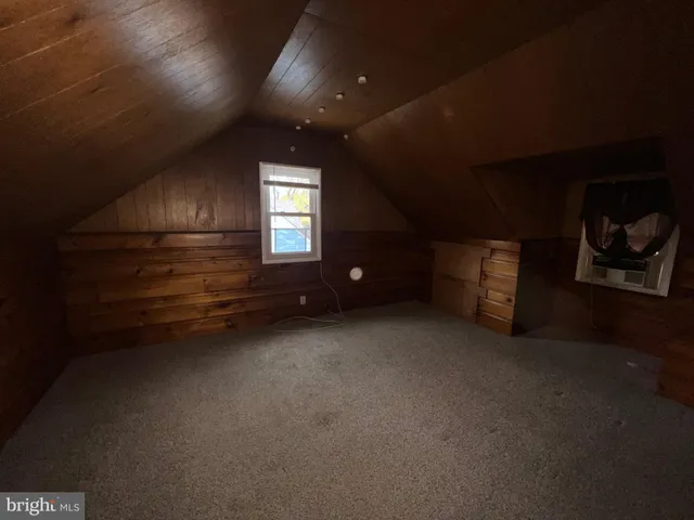 a view of empty room with stairs