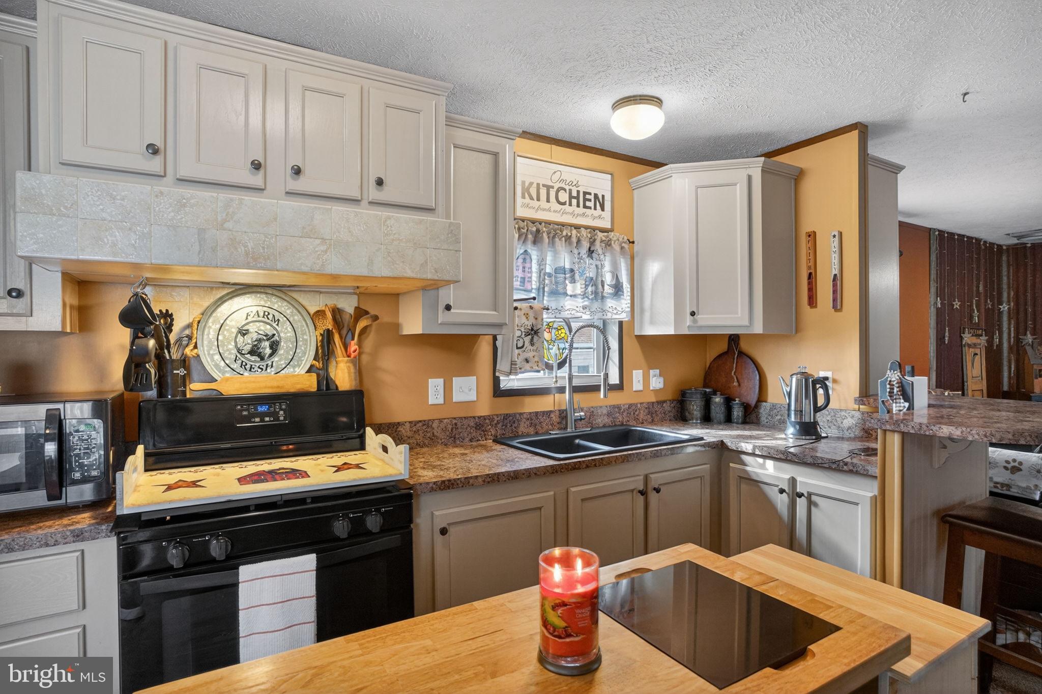 39 Country Club Road West Northampton, PA 18067 - Photo 7 of 26 a kitchen with a stove a sink and a refrigerator