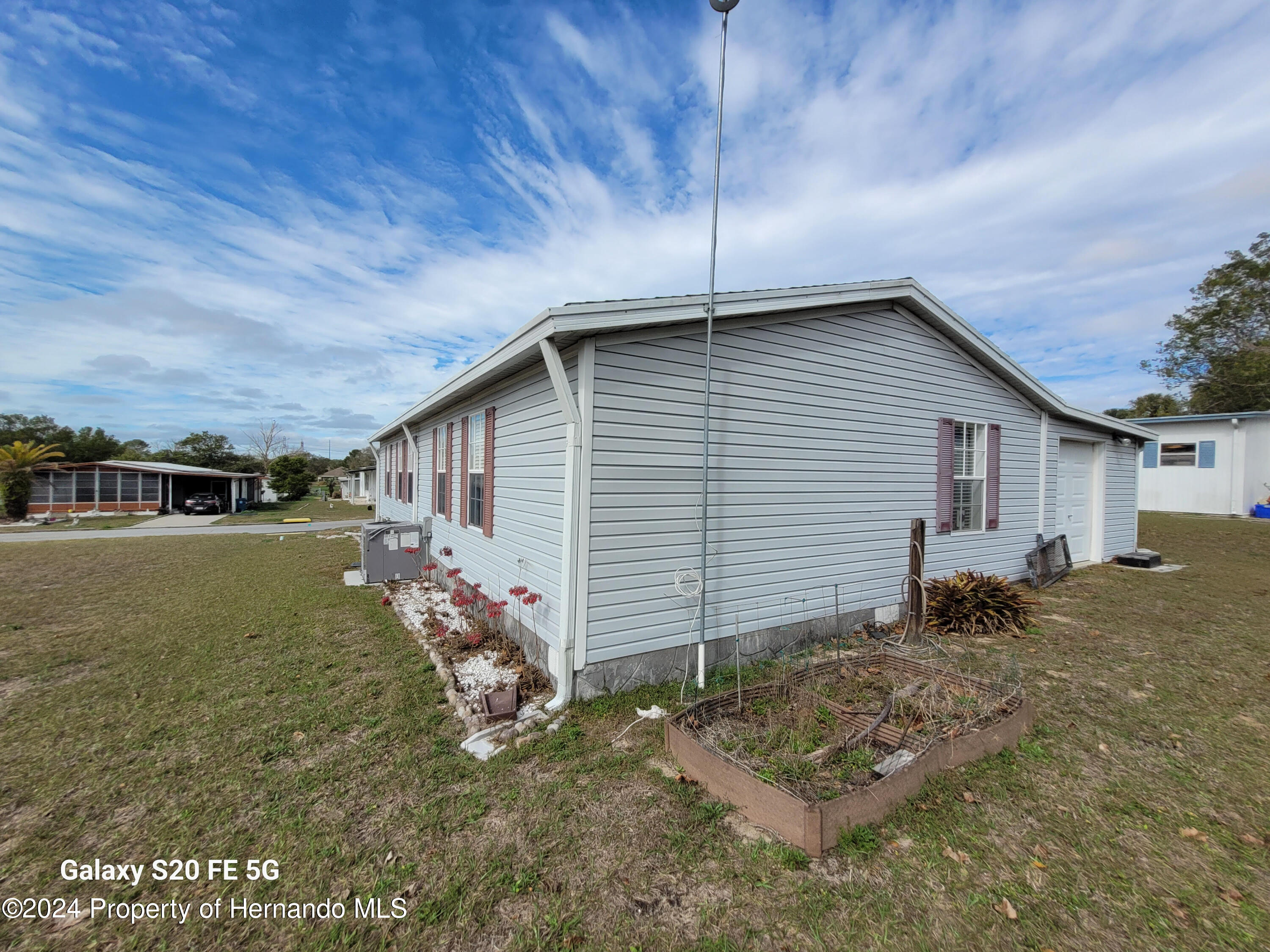 14902 Rialto Avenue Brooksville, FL 34613 - Photo 32 of 55 back-side home 1