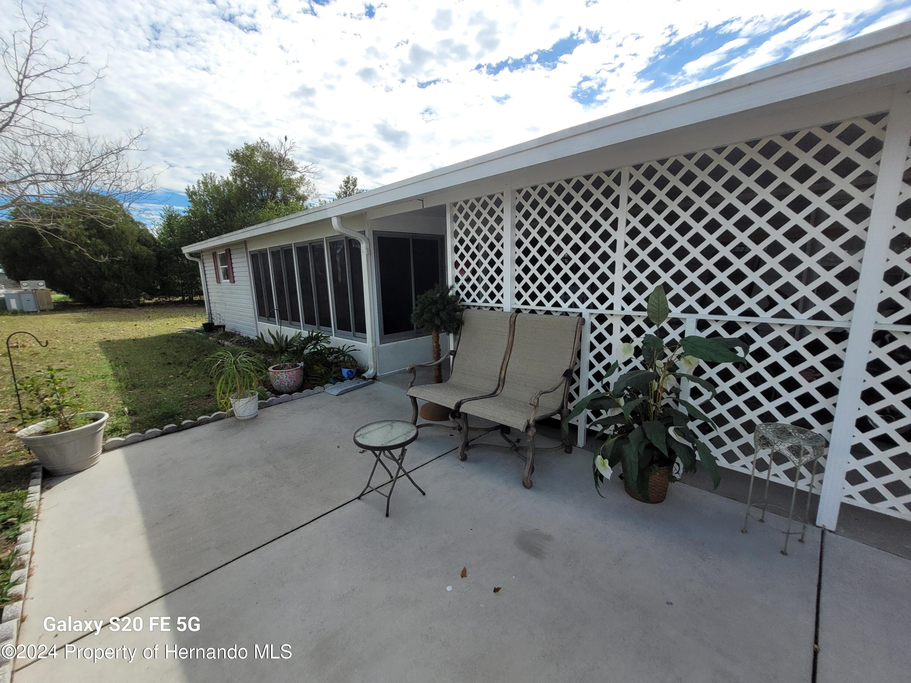 14902 Rialto Avenue Brooksville, FL 34613 - Photo 41 of 55 side porch 3