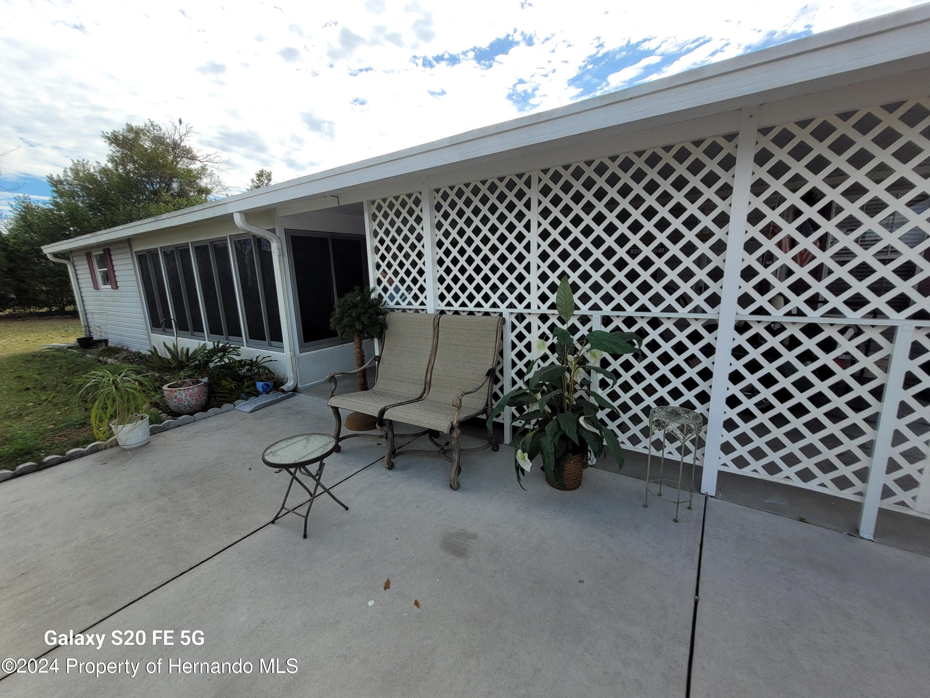 14902 Rialto Avenue Brooksville, FL 34613 - Photo 42 of 55 side porch 2