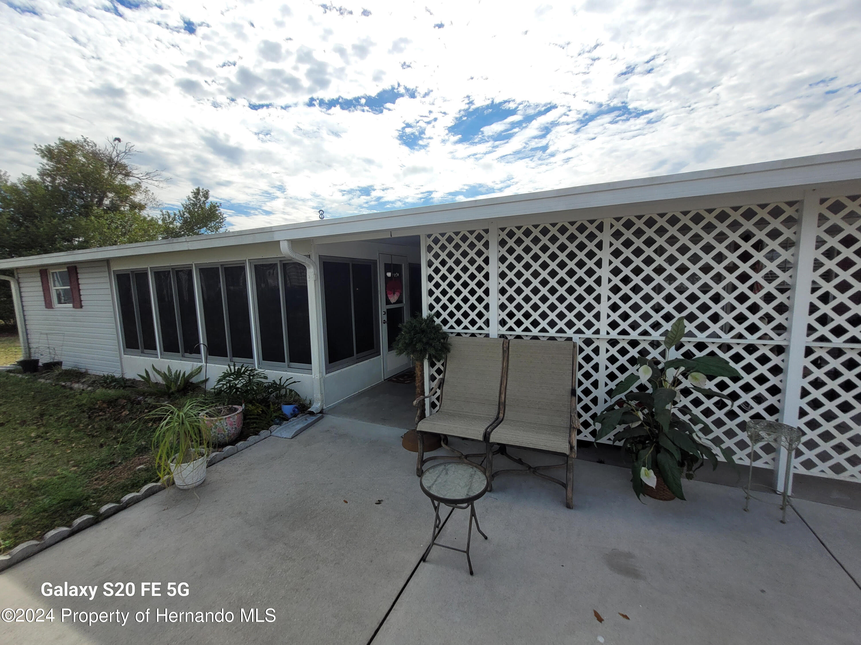14902 Rialto Avenue Brooksville, FL 34613 - Photo 43 of 55 side porch 4