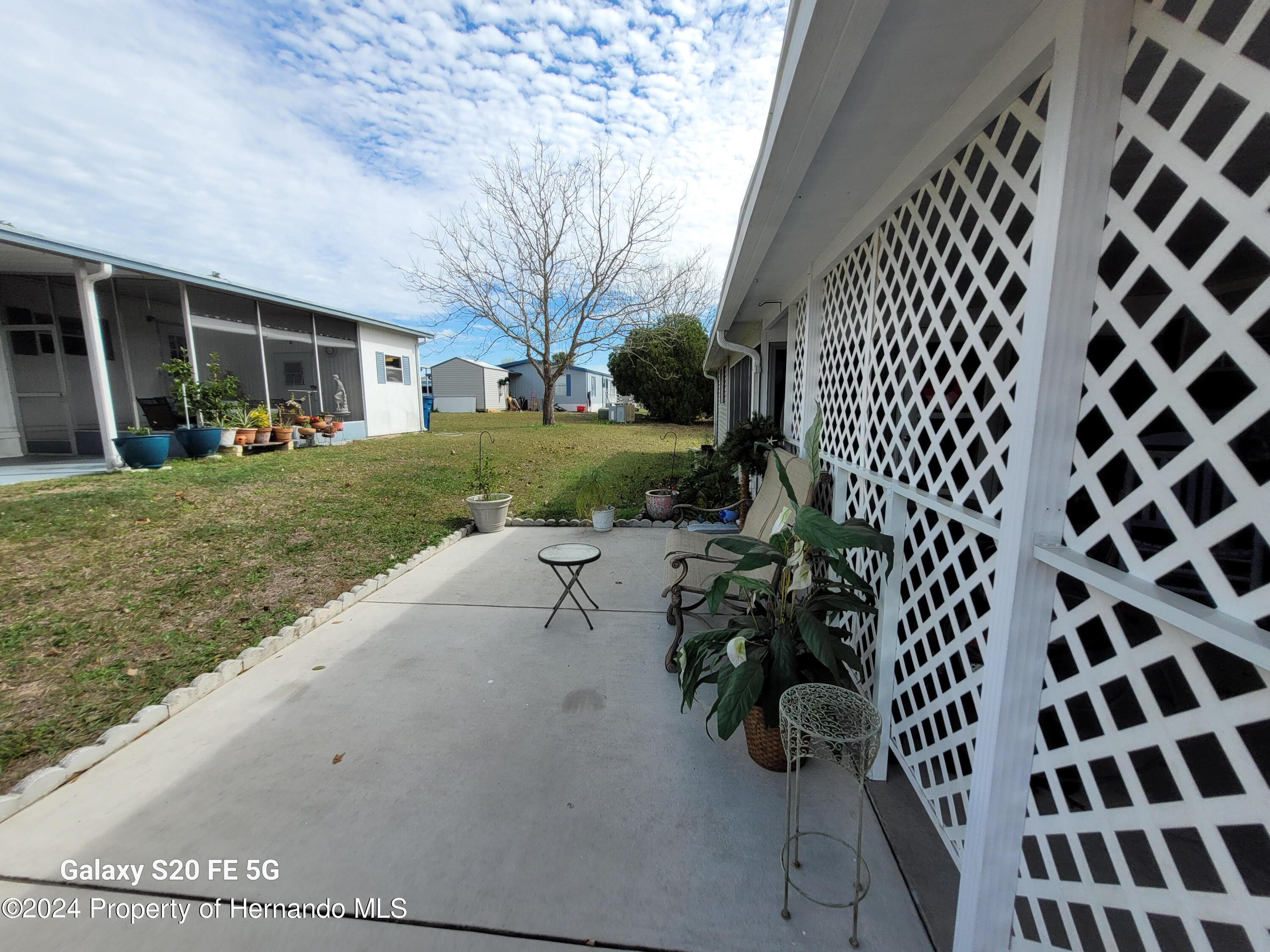 14902 Rialto Avenue Brooksville, FL 34613 - Photo 44 of 55 side porch 1