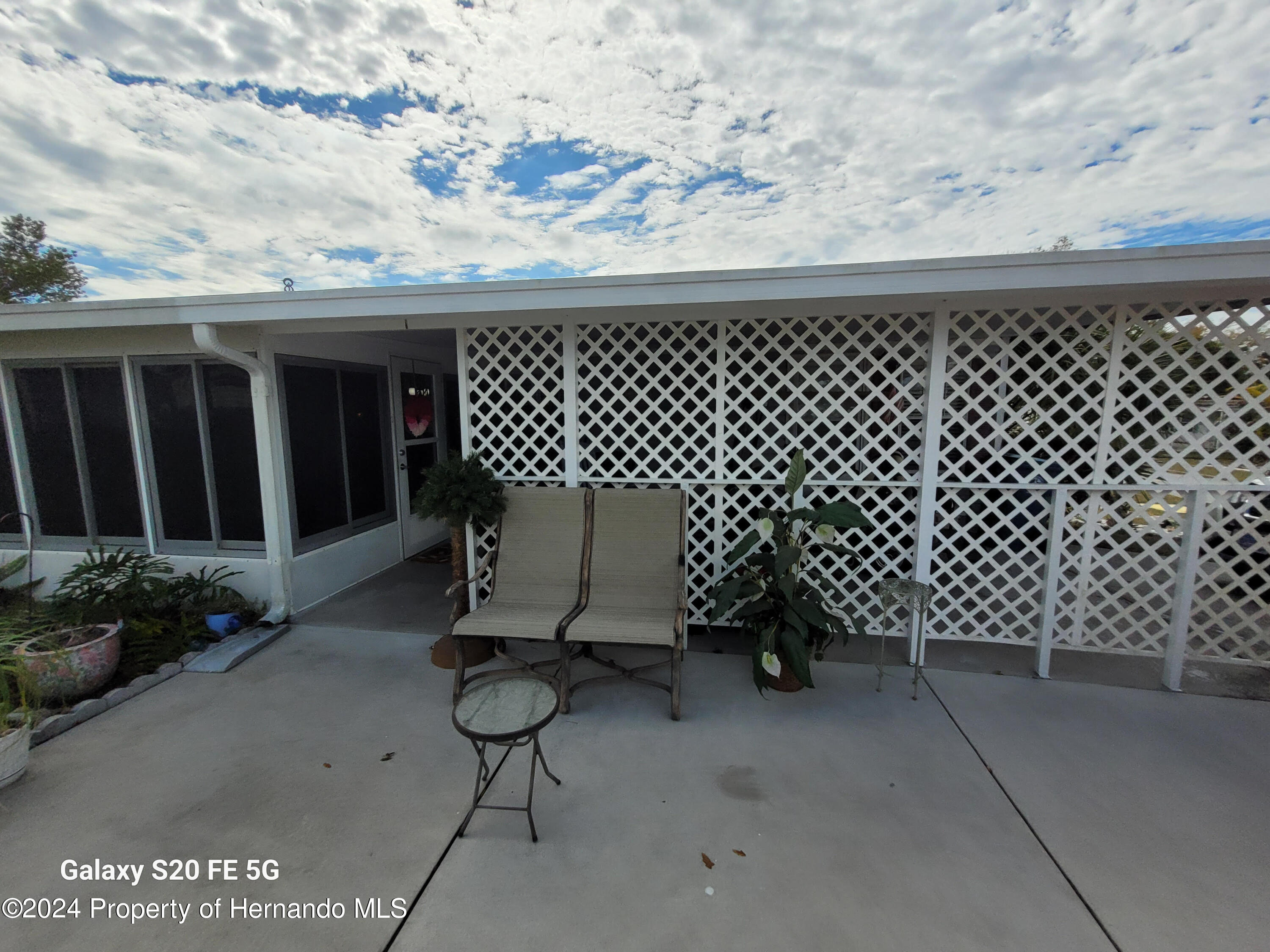 14902 Rialto Avenue Brooksville, FL 34613 - Photo 45 of 55 side porch 5