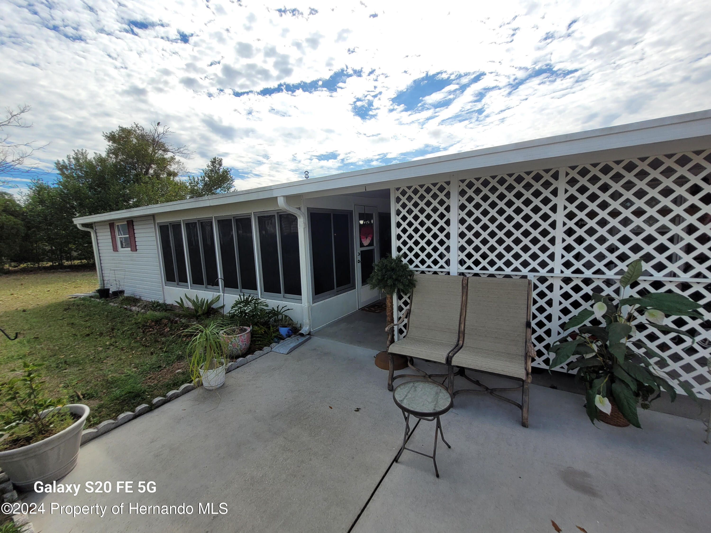 14902 Rialto Avenue Brooksville, FL 34613 - Photo 46 of 55 side porch 6