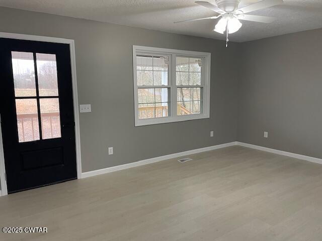 157 Doster Road McKenzie, TN 38201 - Photo 8 of 23 an empty room with chandelier fan and windows