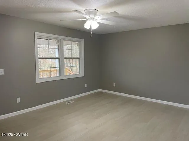 a kitchen with white cabinets stainless steel appliances and a sink