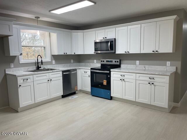 157 Doster Road McKenzie, TN 38201 - Photo 10 of 23 a kitchen with white cabinets stainless steel appliances and a sink