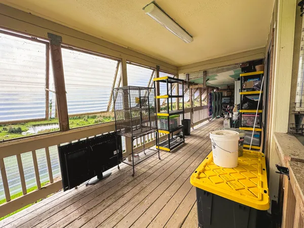 a view of a living room with wooden floor