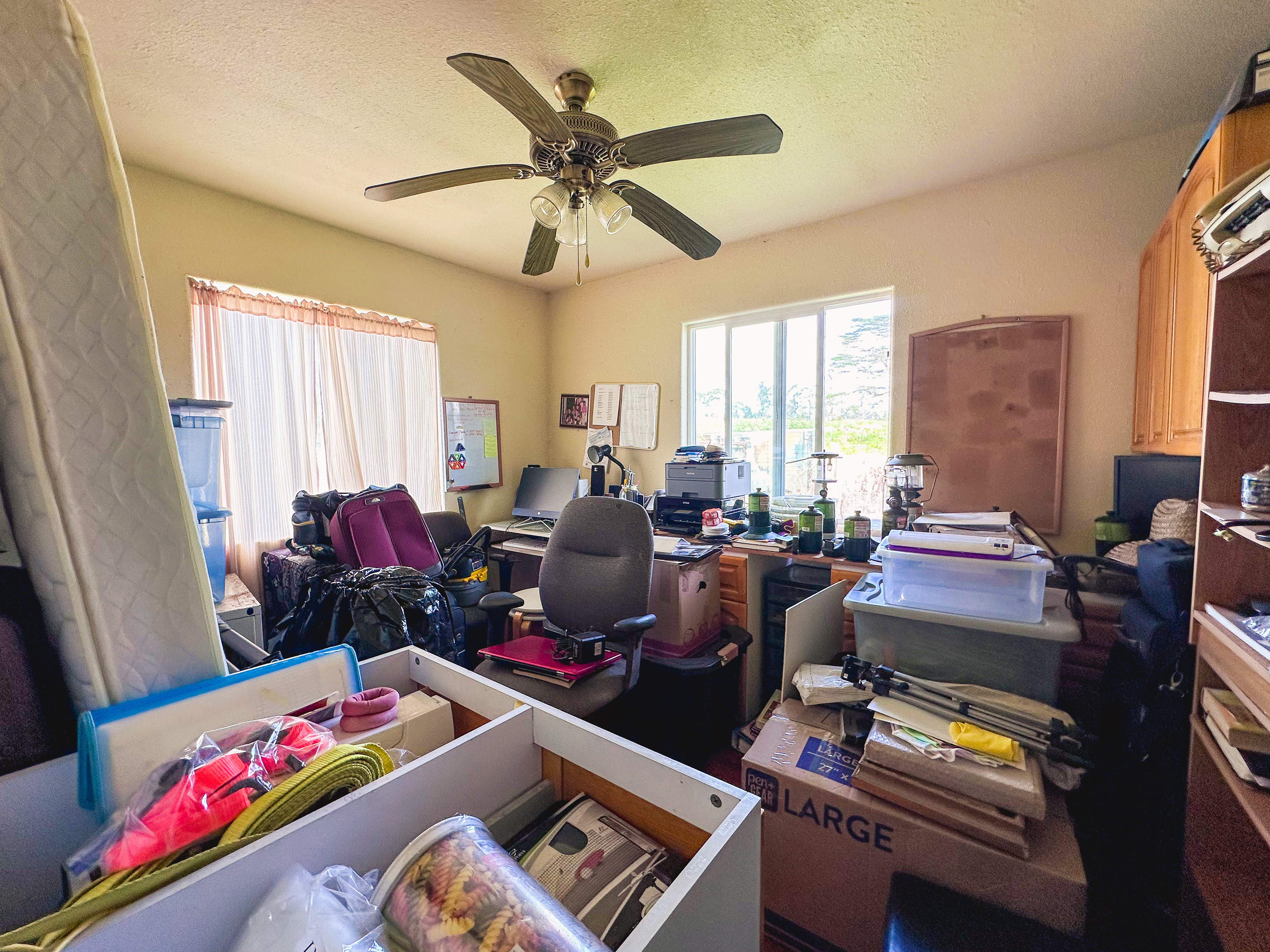 18-7747 North Kulani Road Mountain View, HI 96771 - Photo 24 of 28 a bed room with furniture and a window