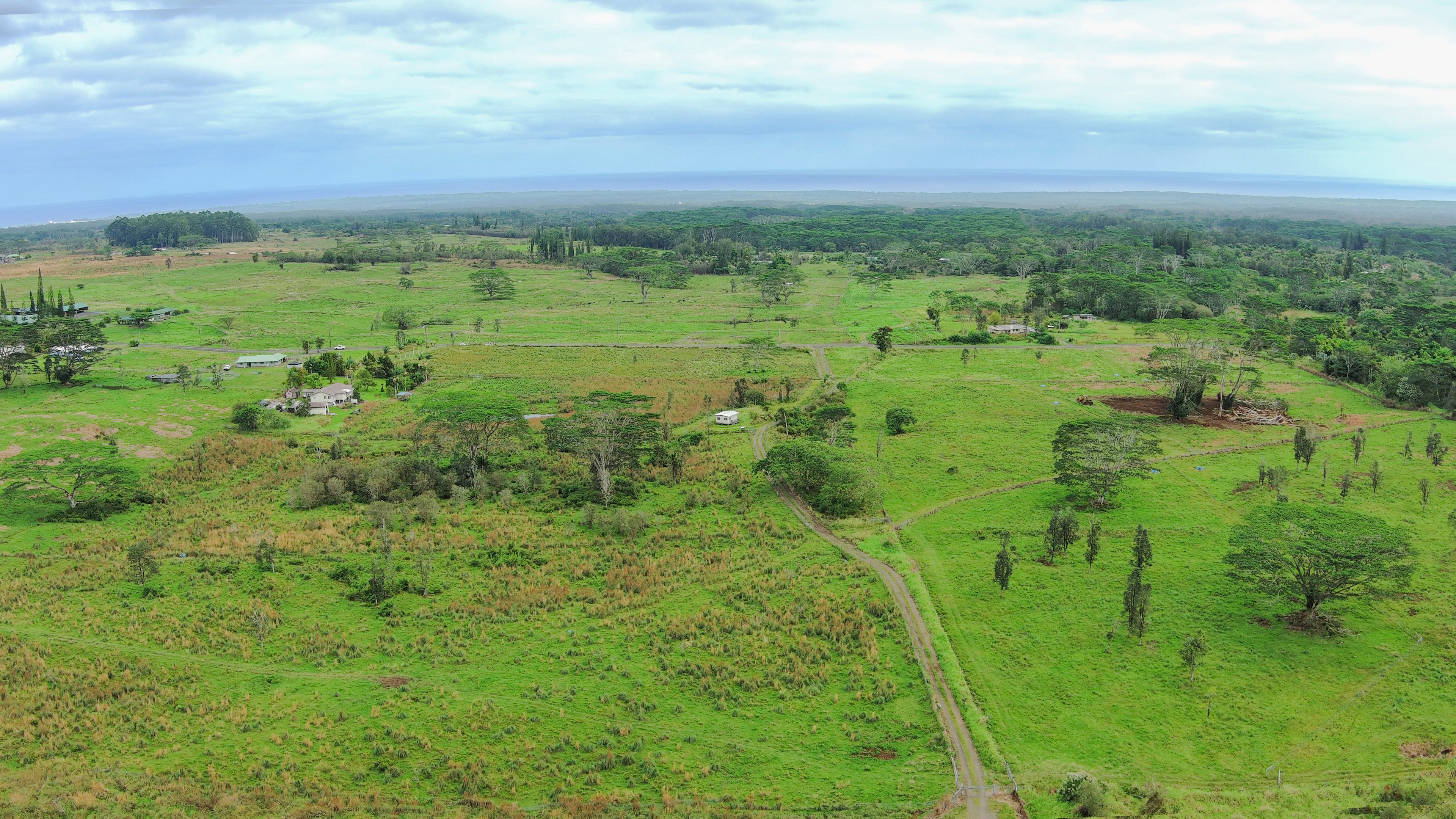 18-7747 North Kulani Road Mountain View, HI 96771 - Photo 7 of 28 a view of a green field with lots of trees