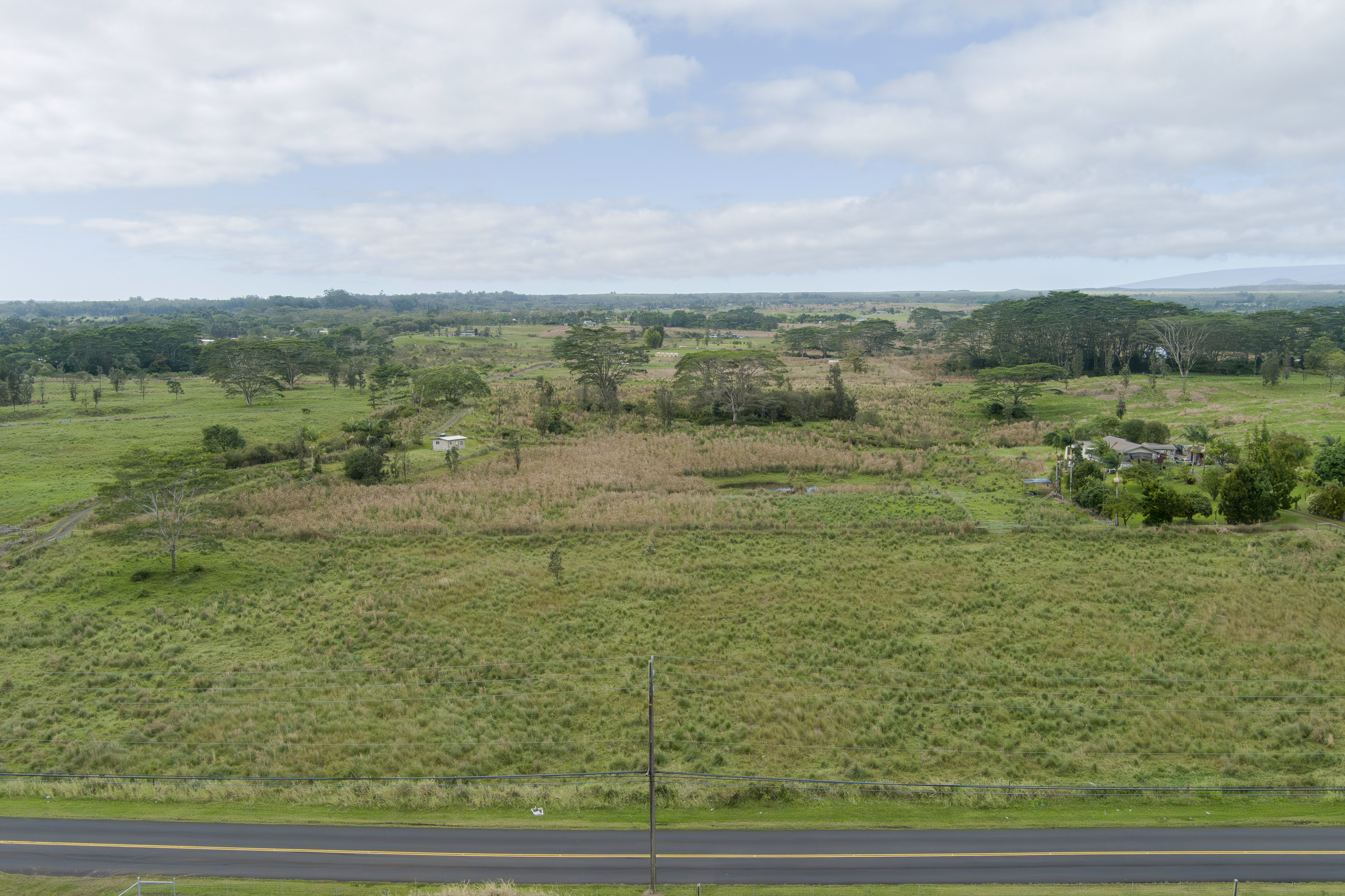 18-7747 North Kulani Road Mountain View, HI 96771 - Photo 10 of 28 a view of a lake with green space
