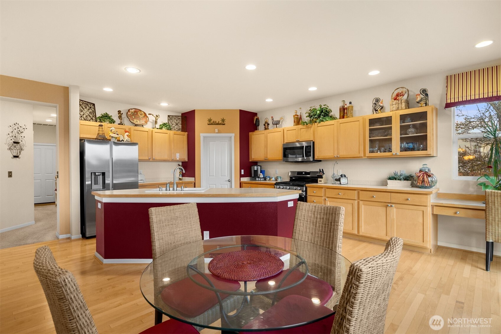 1306 68th Street Southeast Auburn, WA 98092 - Photo 14 of 39 a kitchen with stainless steel appliances kitchen island granite countertop a sink and cabinets