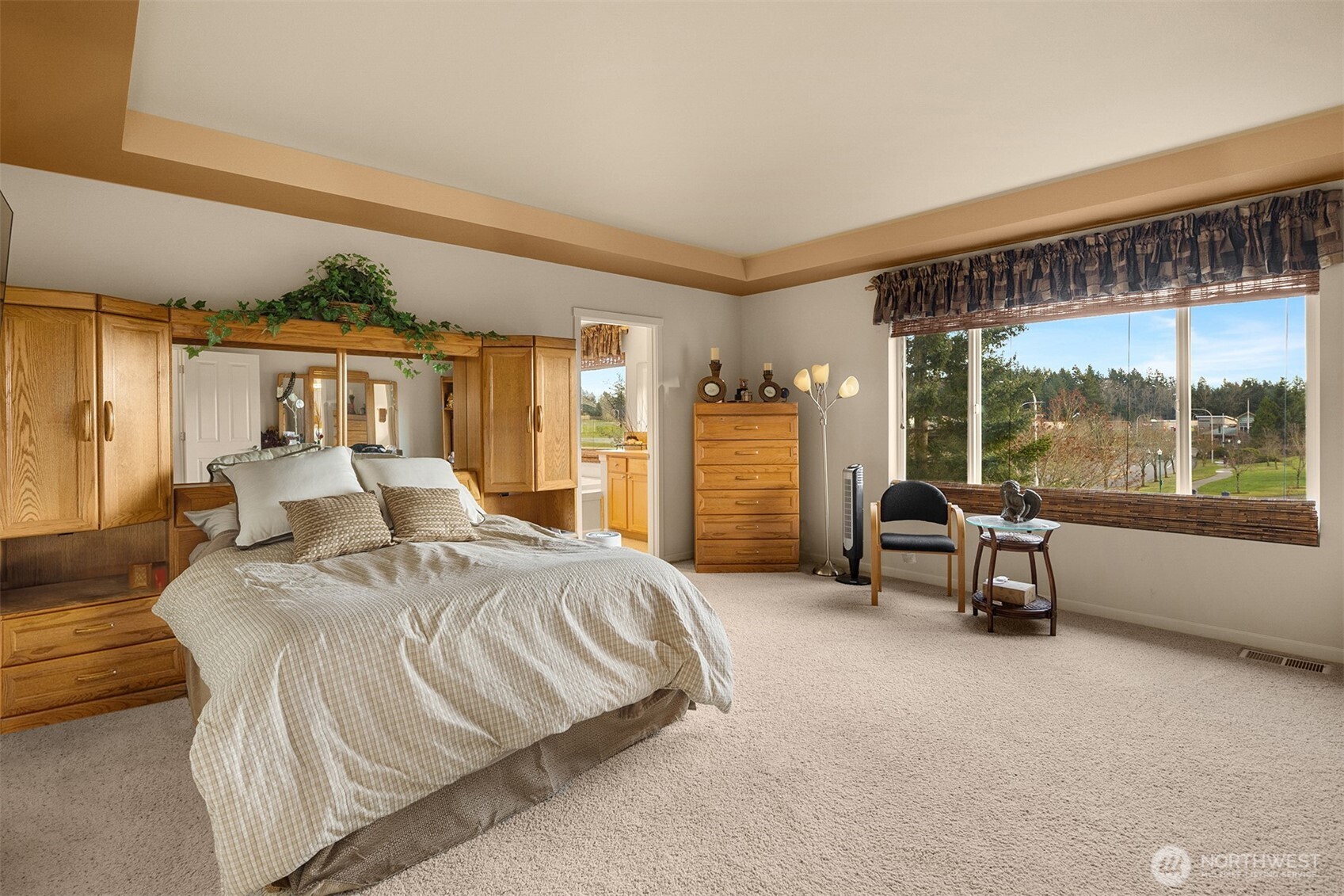 1306 68th Street Southeast Auburn, WA 98092 - Photo 16 of 39 a spacious bedroom with a bed and a large window