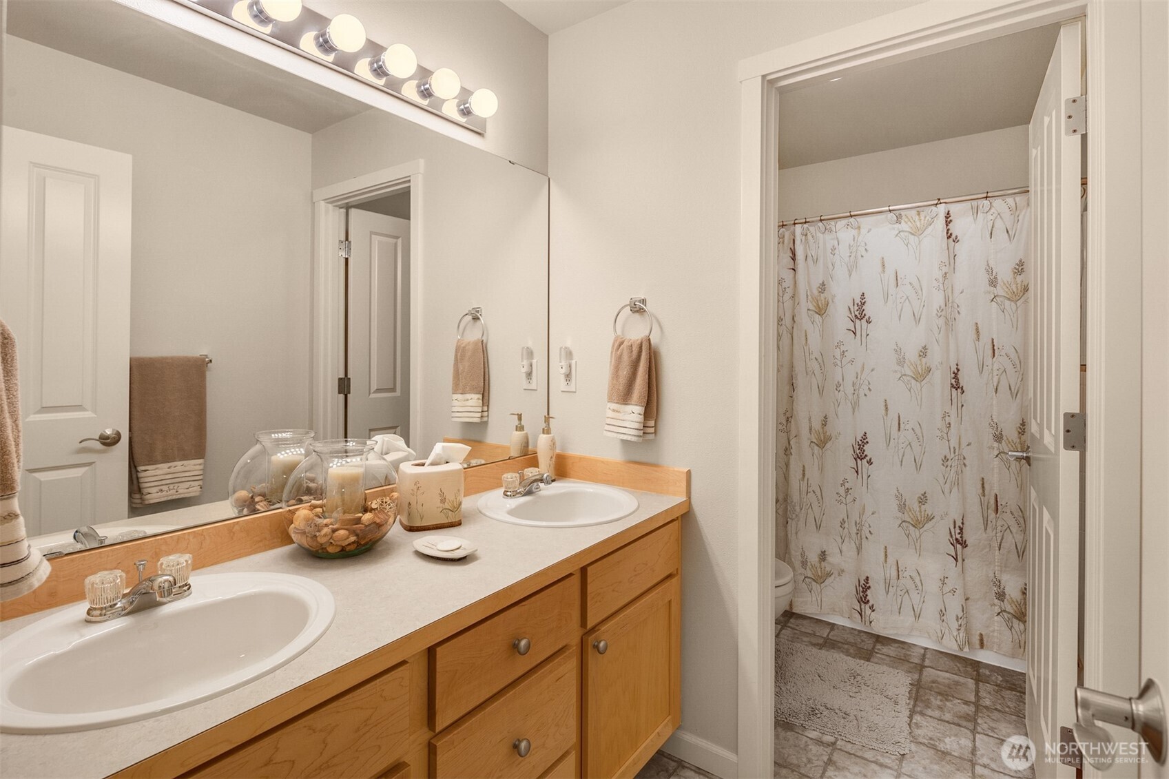1306 68th Street Southeast Auburn, WA 98092 - Photo 20 of 39 a bathroom with a double vanity sink and a mirror