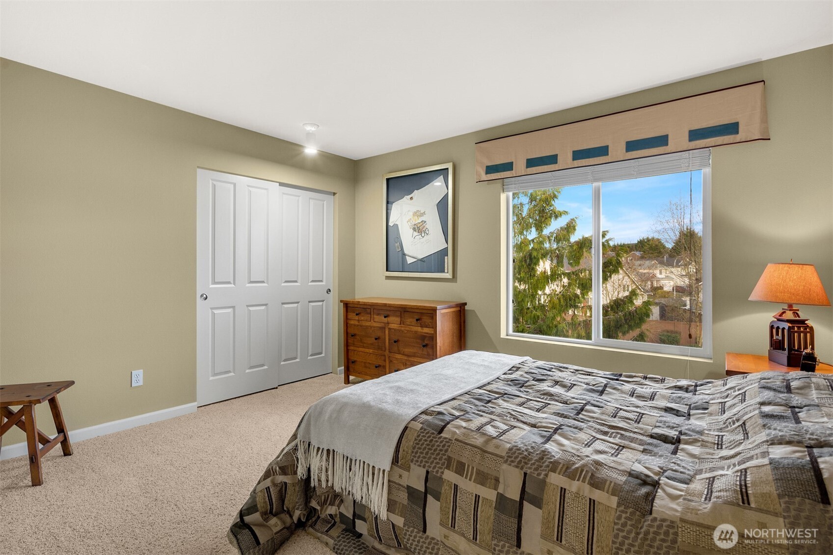 1306 68th Street Southeast Auburn, WA 98092 - Photo 21 of 39 a bedroom with a large bed and a window
