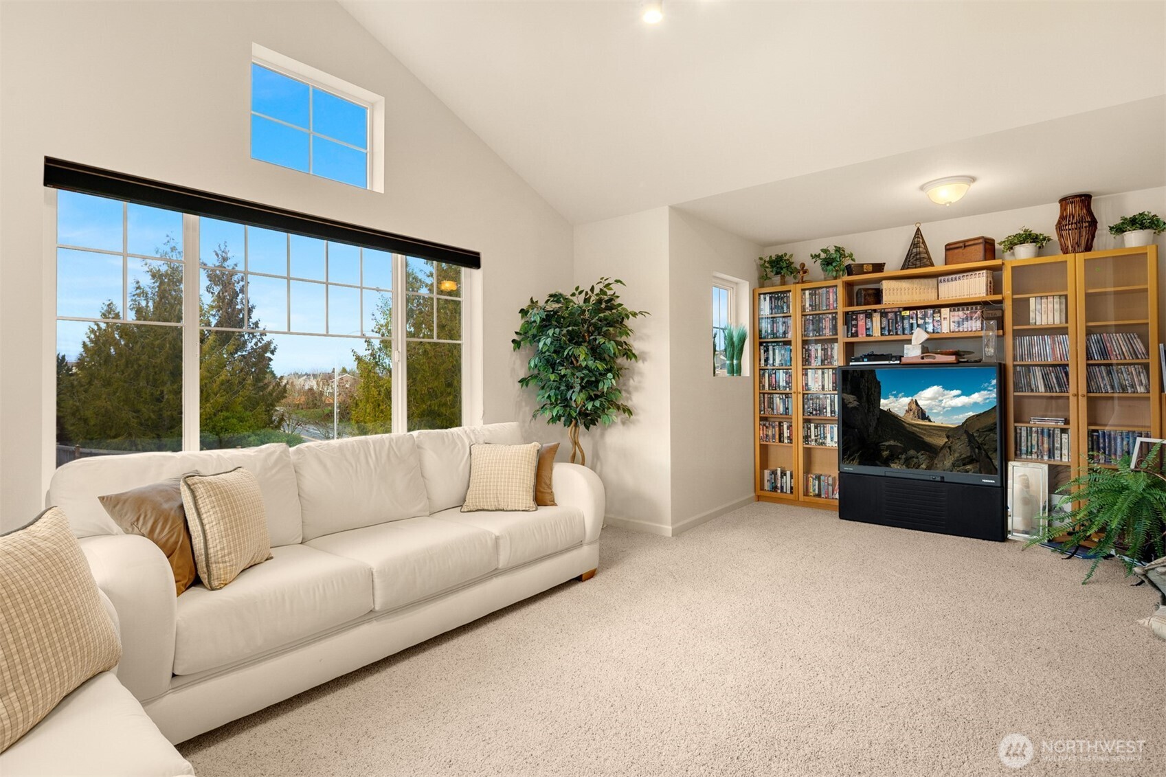 1306 68th Street Southeast Auburn, WA 98092 - Photo 22 of 39 a living room with furniture and a flat screen tv