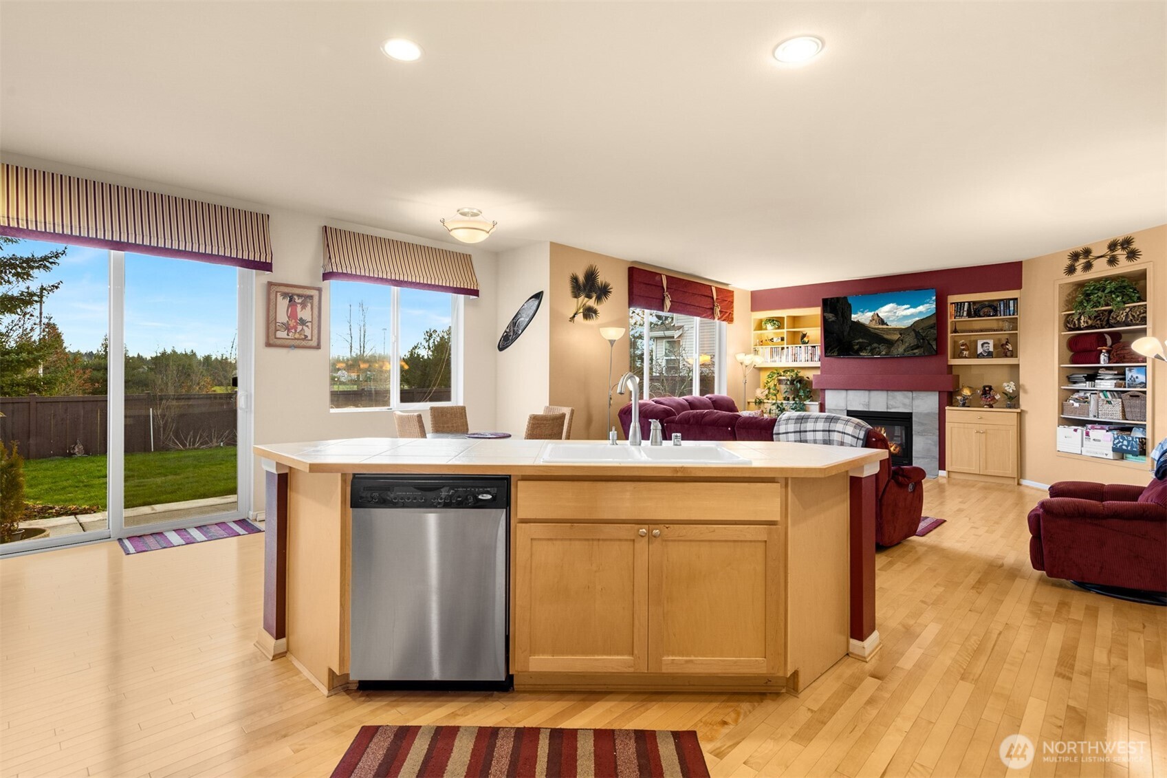 1306 68th Street Southeast Auburn, WA 98092 - Photo 26 of 39 a kitchen with a sink cabinets and wooden floor