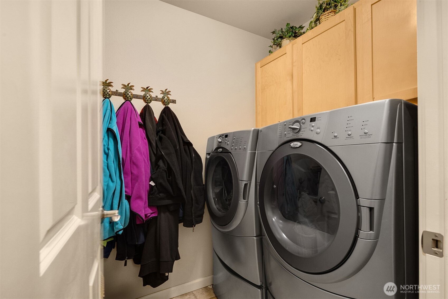 1306 68th Street Southeast Auburn, WA 98092 - Photo 28 of 39 a view of walk in closet with clothes and shoes