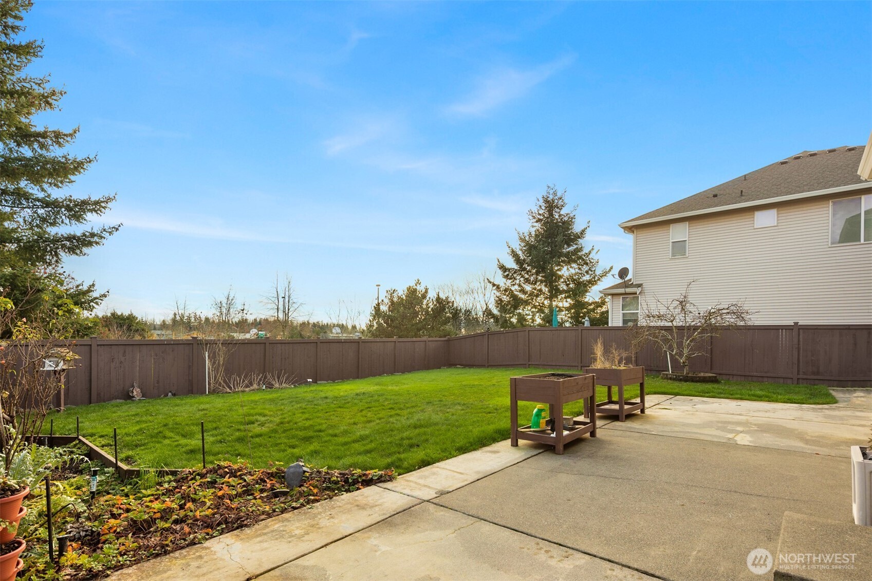 1306 68th Street Southeast Auburn, WA 98092 - Photo 30 of 39 a view of a park with a bench and trees