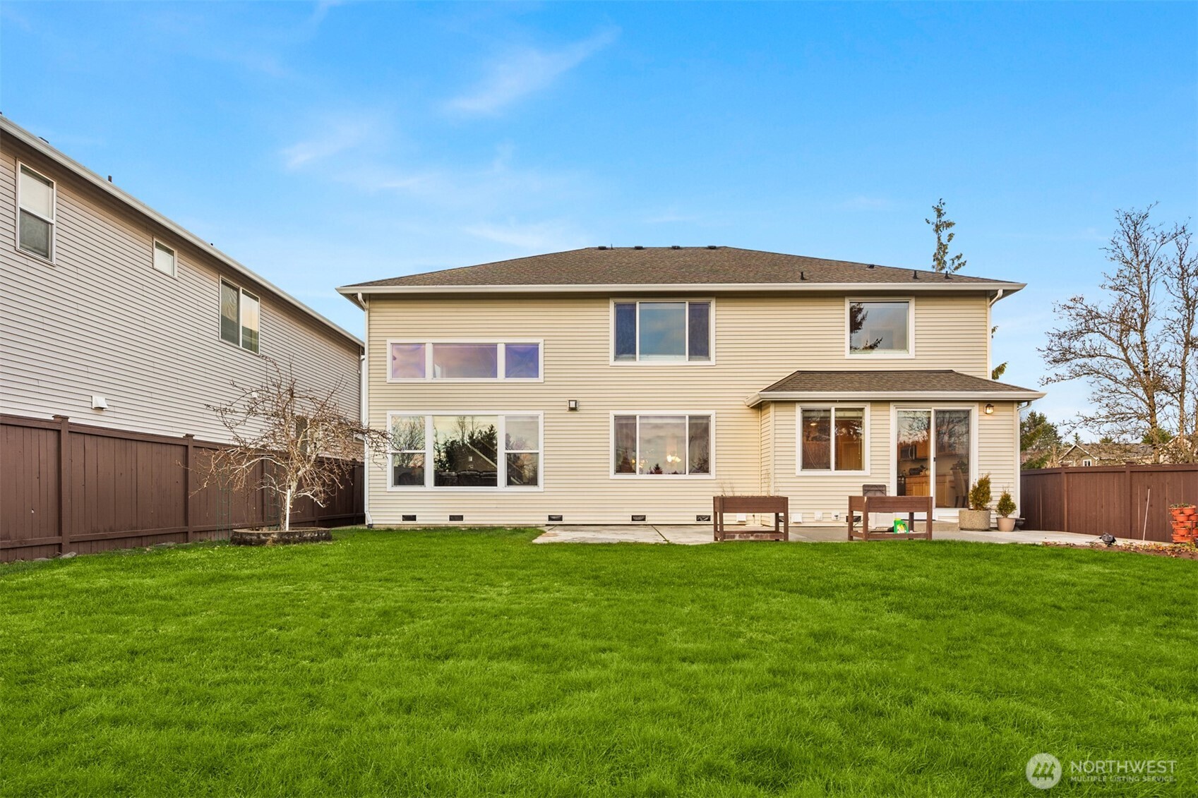 1306 68th Street Southeast Auburn, WA 98092 - Photo 31 of 39 a front view of a house with a garden and trees