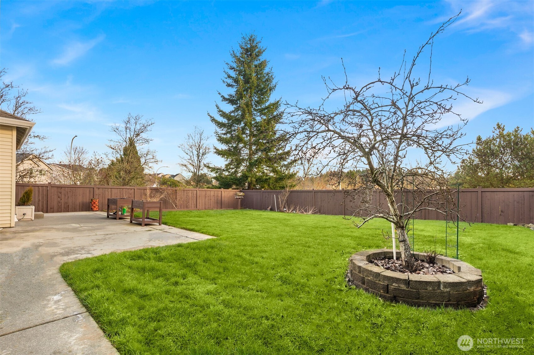 1306 68th Street Southeast Auburn, WA 98092 - Photo 34 of 39 a green field with lots of tress in it