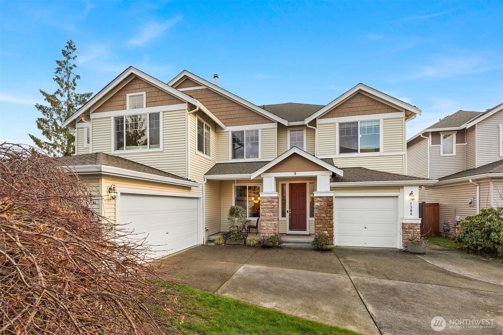 1306 68th Street Southeast Auburn, WA 98092 - Photo 35 of 39 a front view of a house with a yard and garage