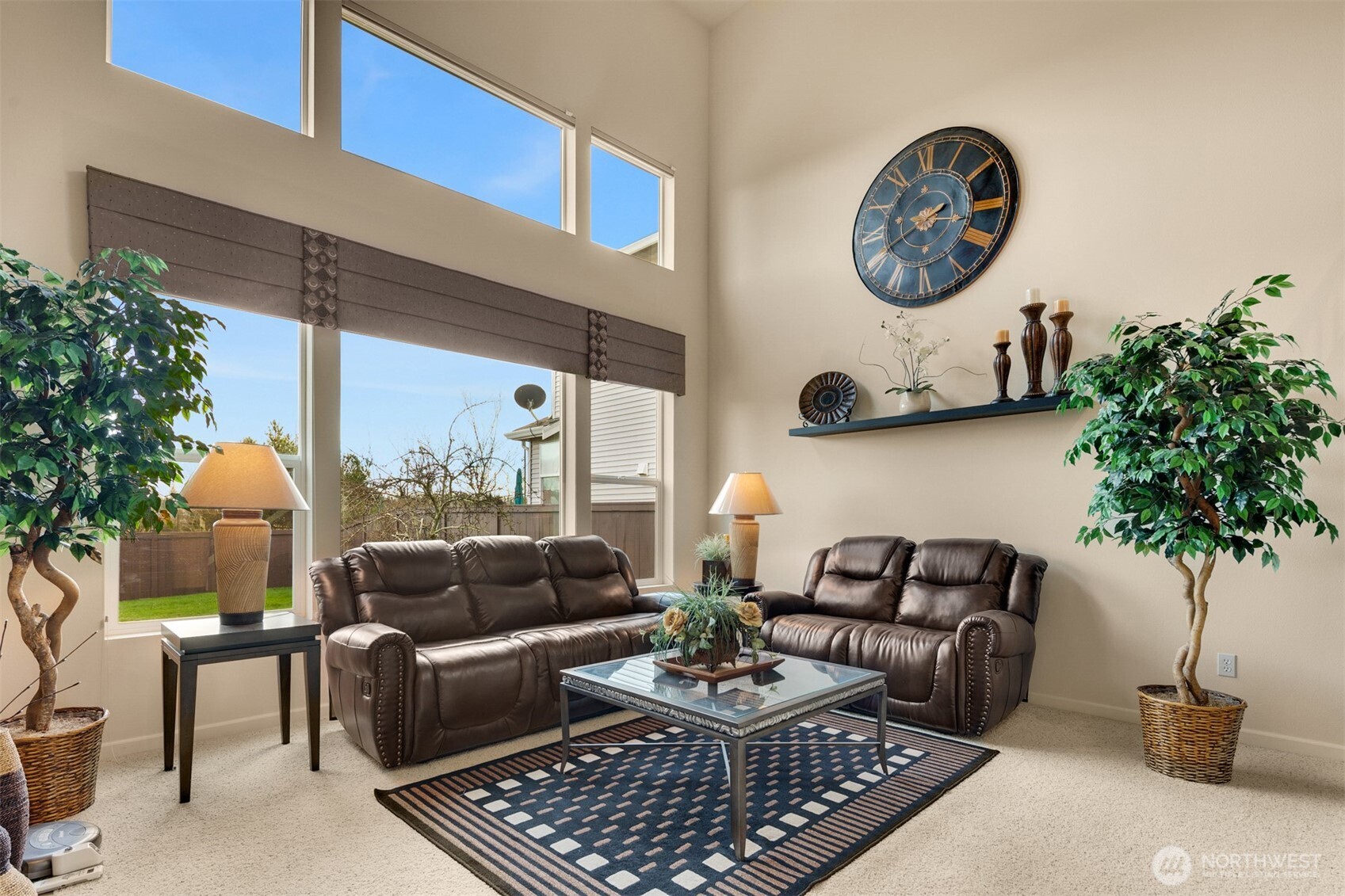 1306 68th Street Southeast Auburn, WA 98092 - Photo 4 of 39 a living room with furniture a rug and a potted plant