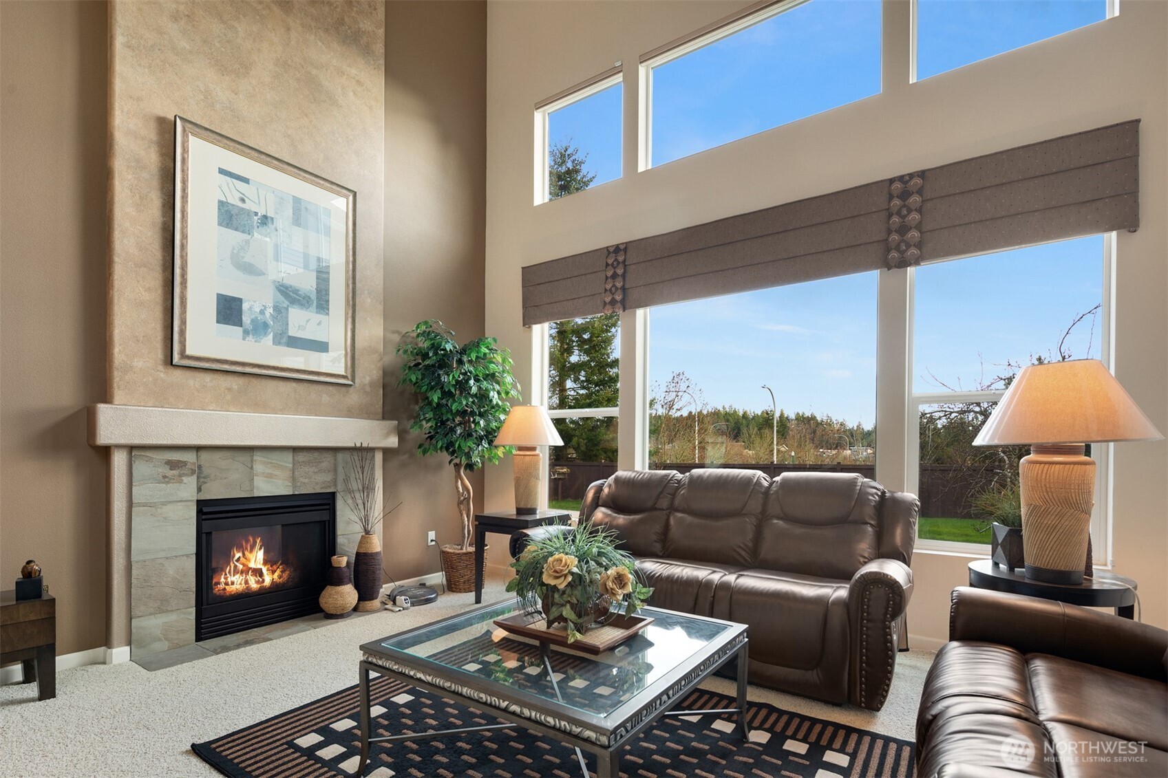 1306 68th Street Southeast Auburn, WA 98092 - Photo 5 of 39 a living room with furniture and a fireplace