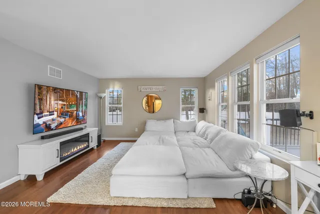 a bedroom with a bed and a flat screen television