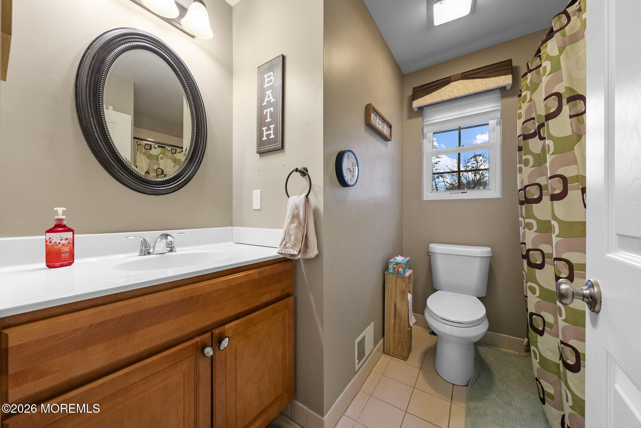 276 Andrews Road Jackson, NJ 08527 - Photo 32 of 46 a bathroom with a toilet a sink and a mirror