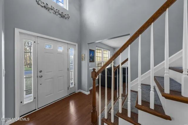 a view of an entryway with wooden floor