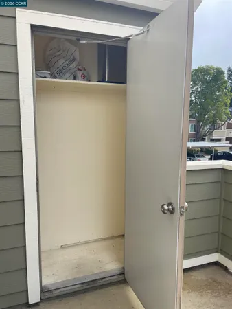 a bedroom with a large bed and a flat screen tv