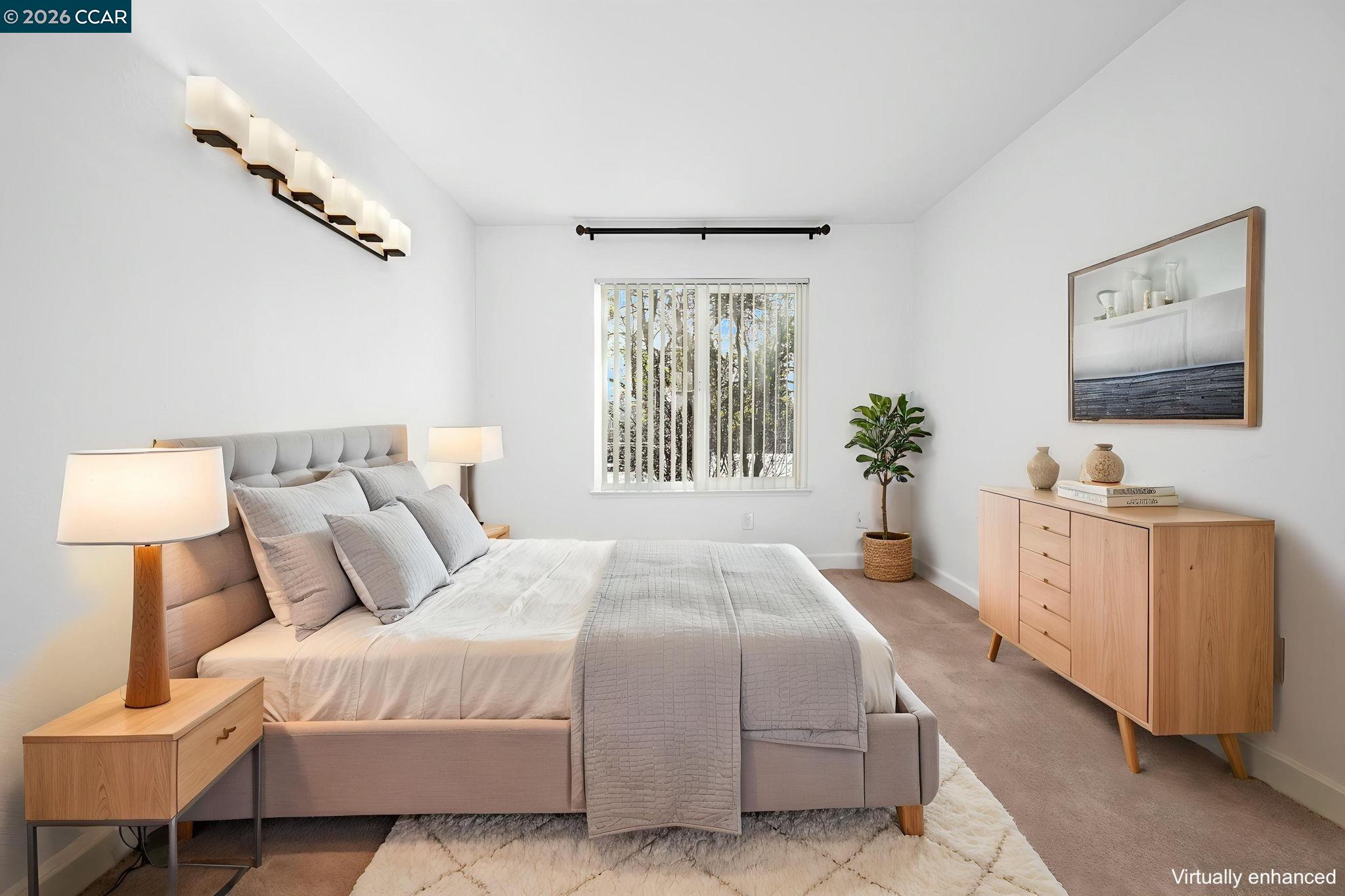 140 Reflections Drive, Unit 21 San Ramon, CA 94583 - Photo 16 of 34 a bedroom with a large bed and a flat screen tv