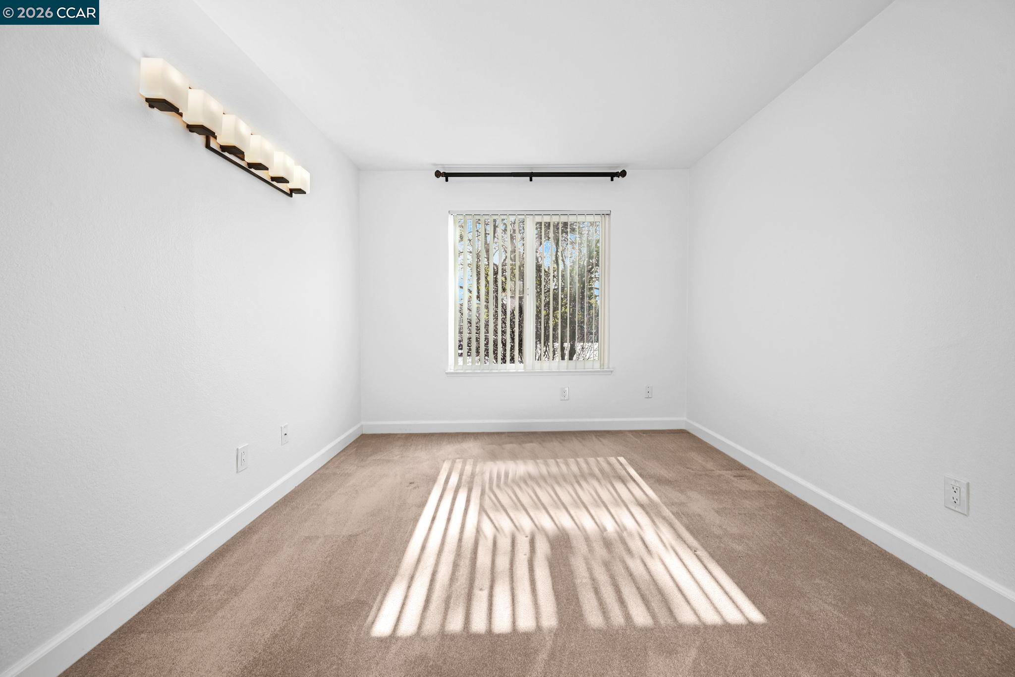 140 Reflections Drive, Unit 21 San Ramon, CA 94583 - Photo 17 of 34 an empty room with windows