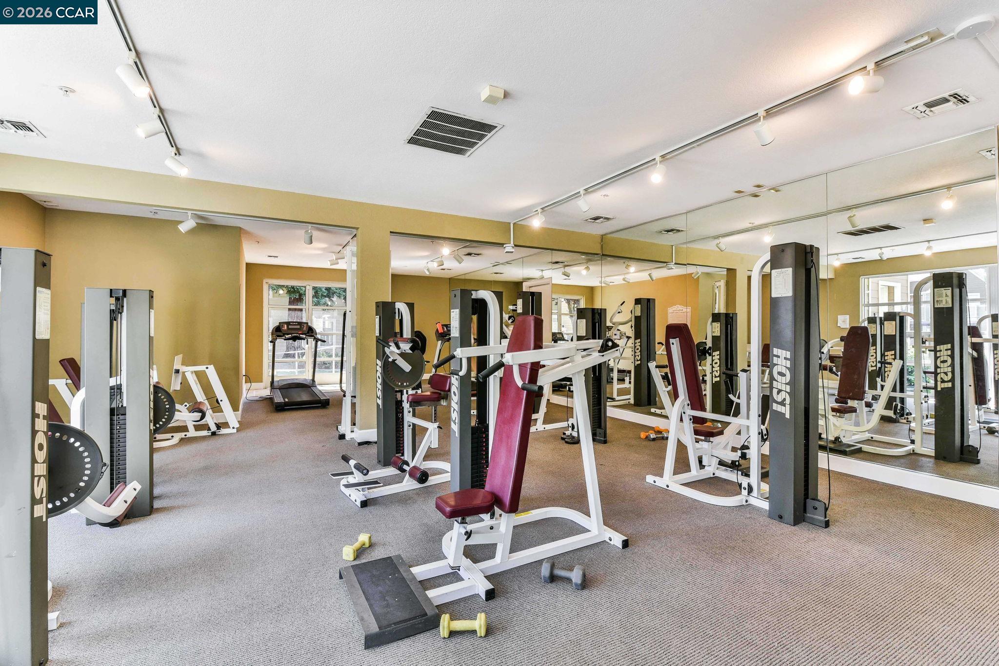 140 Reflections Drive, Unit 21 San Ramon, CA 94583 - Photo 27 of 34 a view of a room with gym equipment