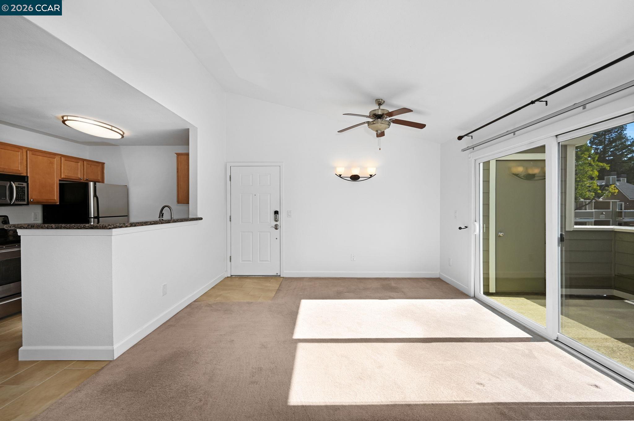 140 Reflections Drive, Unit 21 San Ramon, CA 94583 - Photo 3 of 34 a view of a kitchen with a sink and a window
