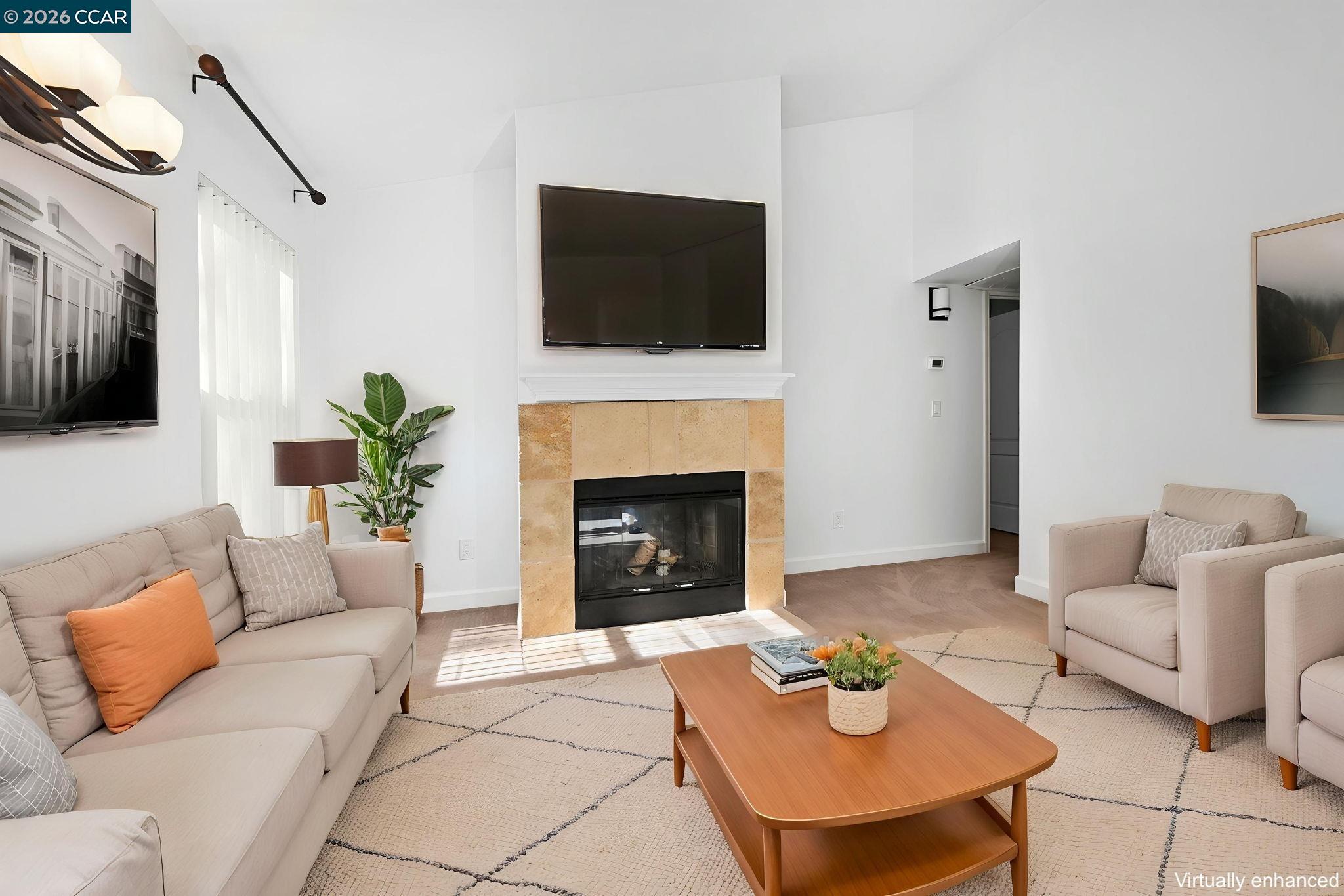 140 Reflections Drive, Unit 21 San Ramon, CA 94583 - Photo 4 of 34 a living room with furniture and a fireplace