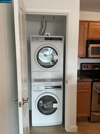a kitchen with stainless steel appliances granite countertop a sink stove and microwave