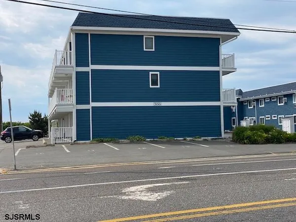 a view of a house with a street