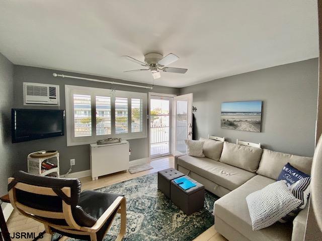 212 West Brigantine Avenue, Unit 215 Brigantine, NJ 08203 - Photo 6 of 20 a living room with furniture and a flat screen tv