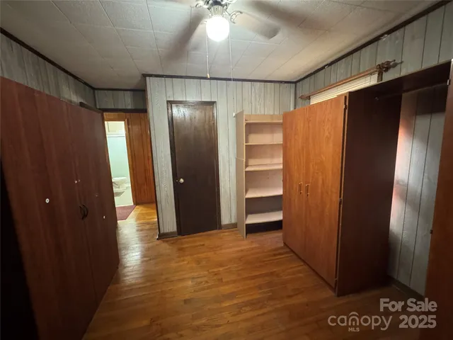 a view of entryway with wooden walls