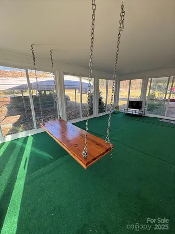 a view of a backyard with sitting area