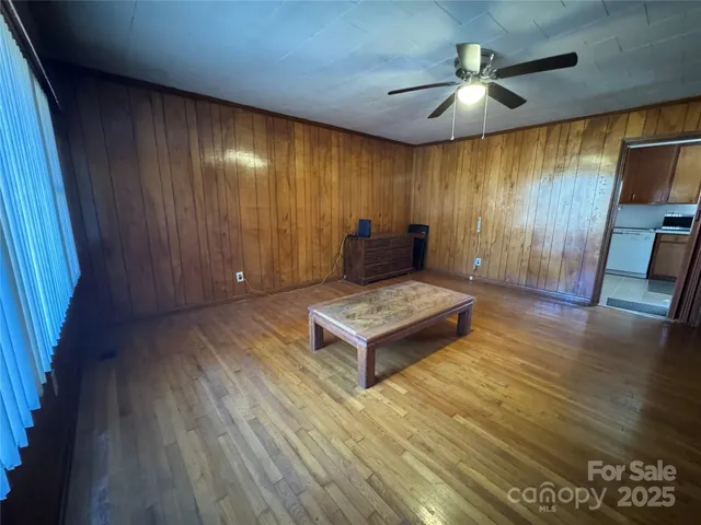 a living room with furniture rug and window