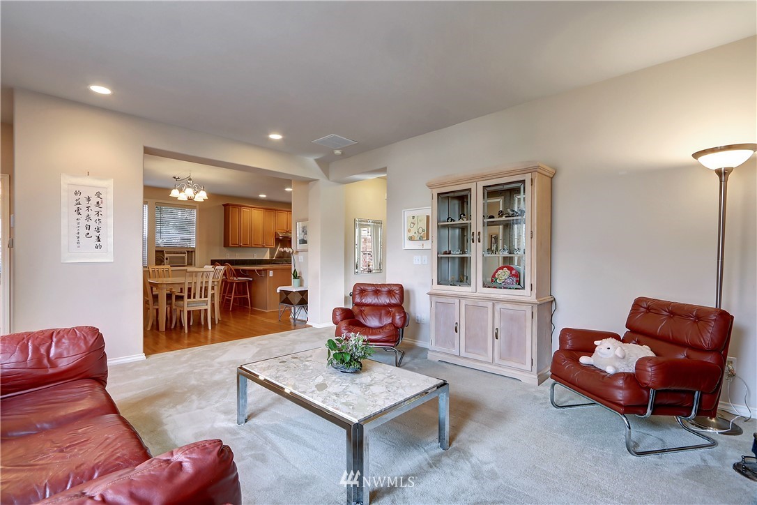 17013 Parkside Way Southeast Renton, WA 98058 - Photo 11 of 26 a living room with furniture and kitchen view