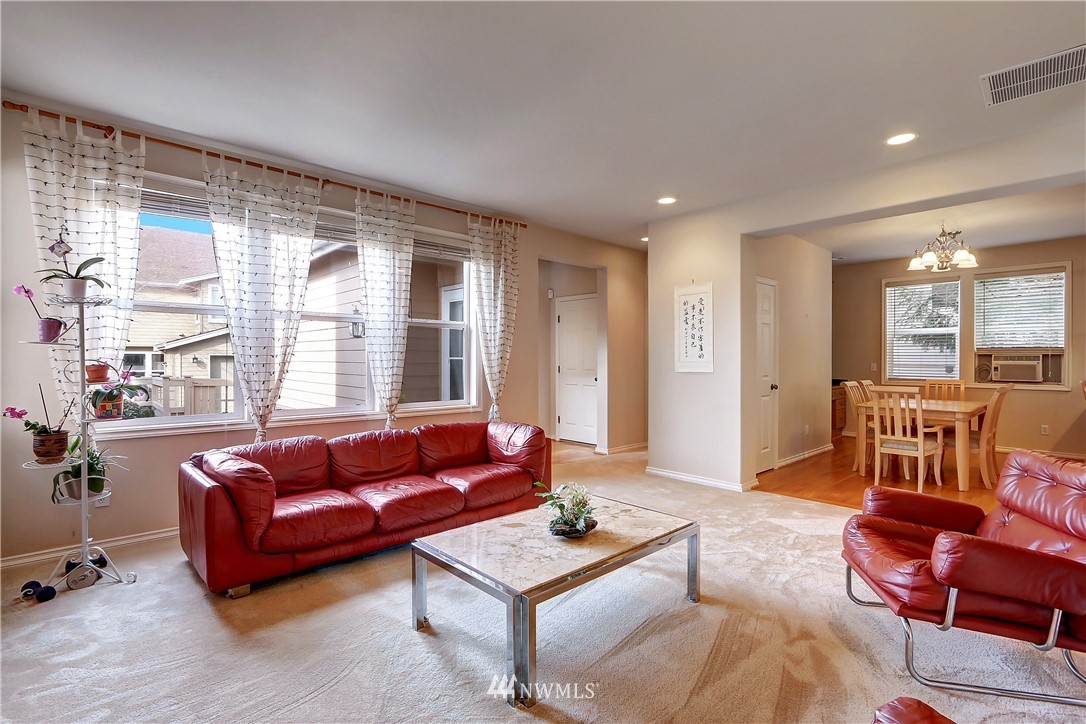 17013 Parkside Way Southeast Renton, WA 98058 - Photo 12 of 26 a living room with furniture and a large window