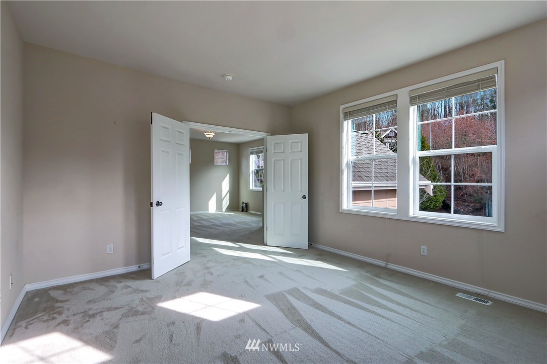17013 Parkside Way Southeast Renton, WA 98058 - Photo 16 of 26 an empty room with windows