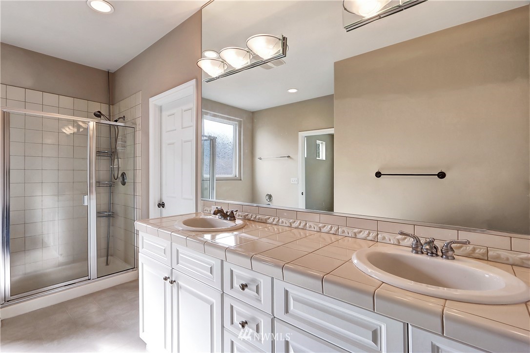 17013 Parkside Way Southeast Renton, WA 98058 - Photo 19 of 26 a bathroom with a sink and a mirror